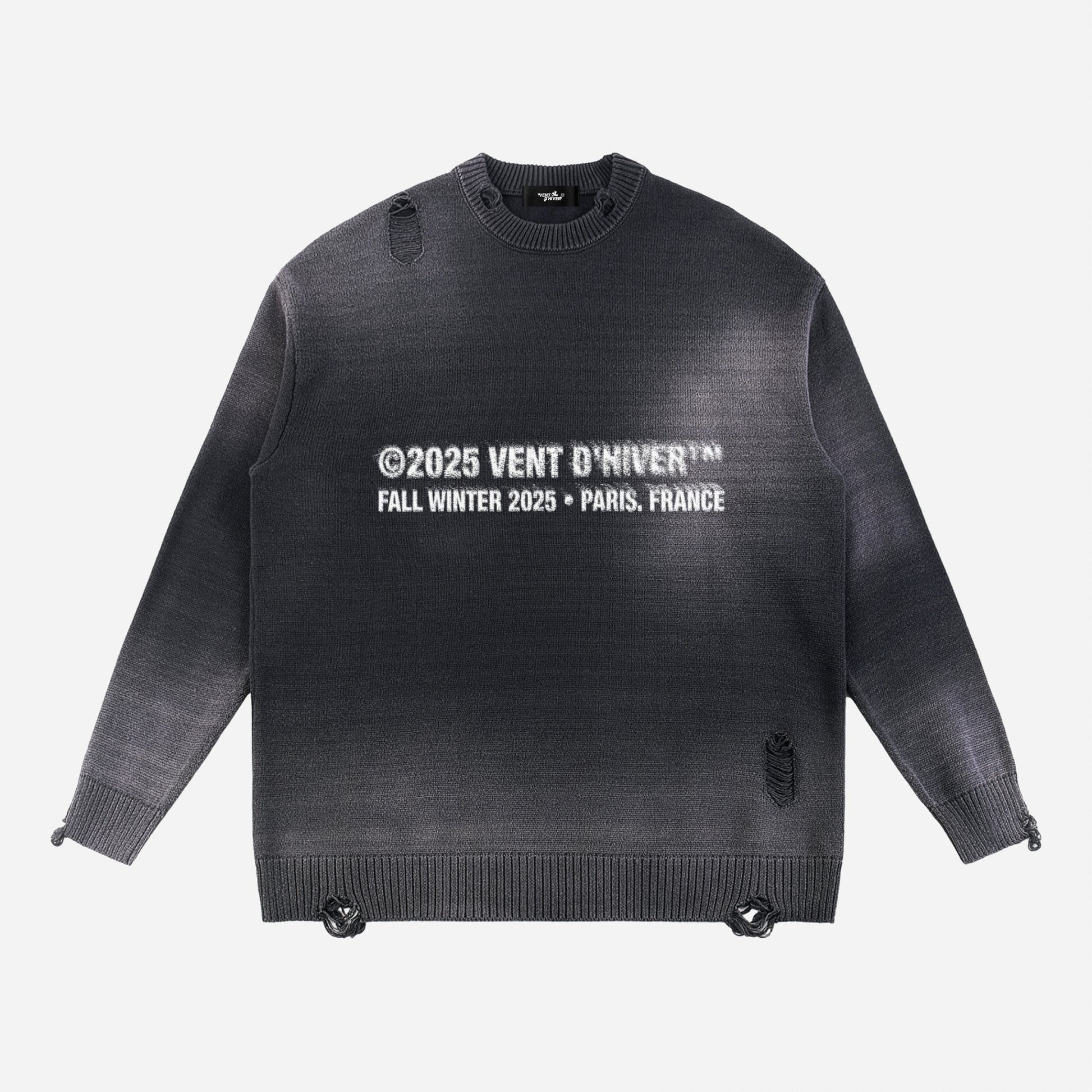 Black sweater with white text on a light gray background