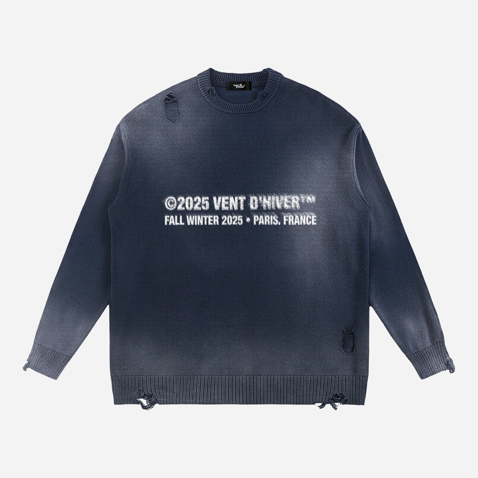 Navy sweater with white text on a light gray background