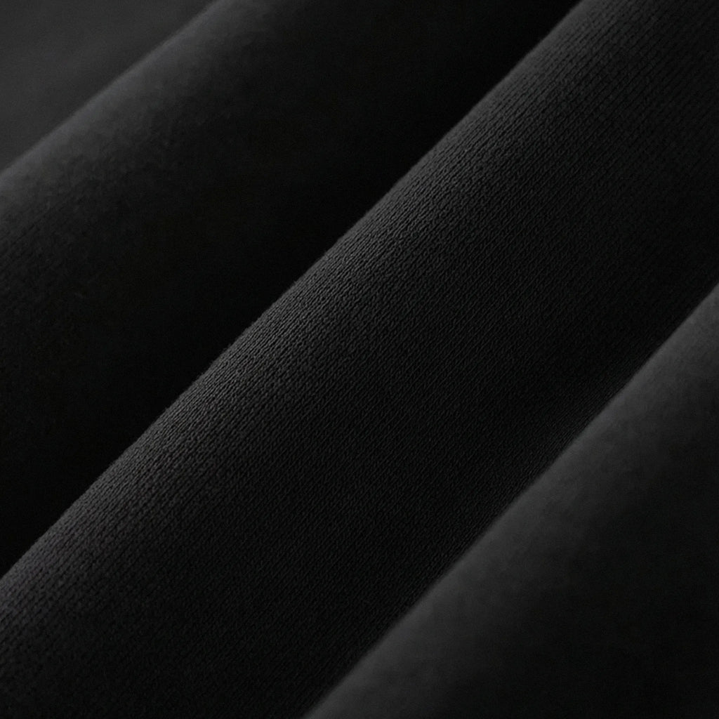 Close-up of dark gray fabric with a subtle texture