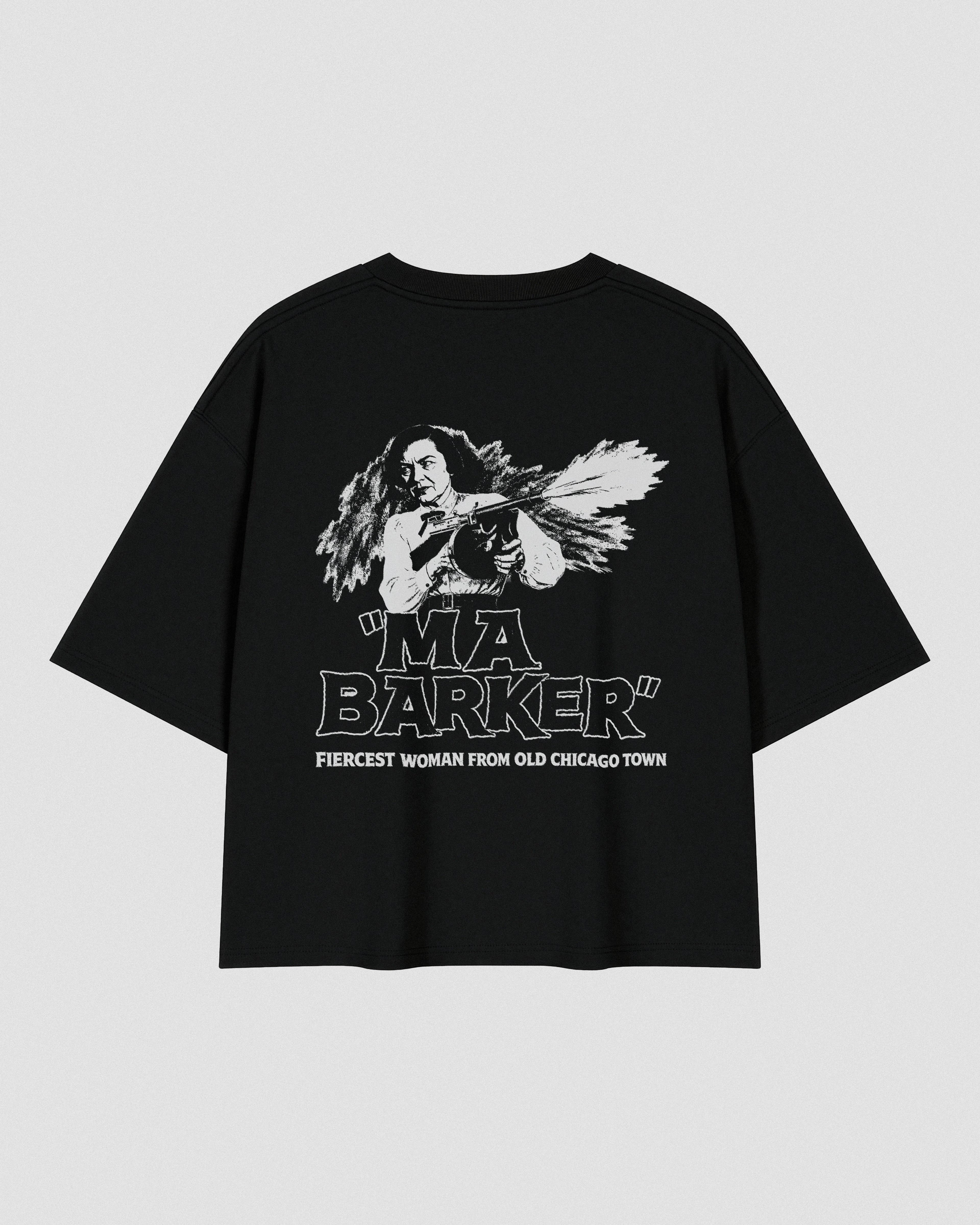 Black oversized heavyweight cotton T-shirt featuring a small white VENT D'HIVER® logo on the front chest. The back showcases a vintage monochrome illustration of Ma Barker holding a Thompson submachine gun, with large distressed "MA BARKER" typography and the phrase "FIERCEST WOMAN FROM OLD CHICAGO TOWN" beneath.