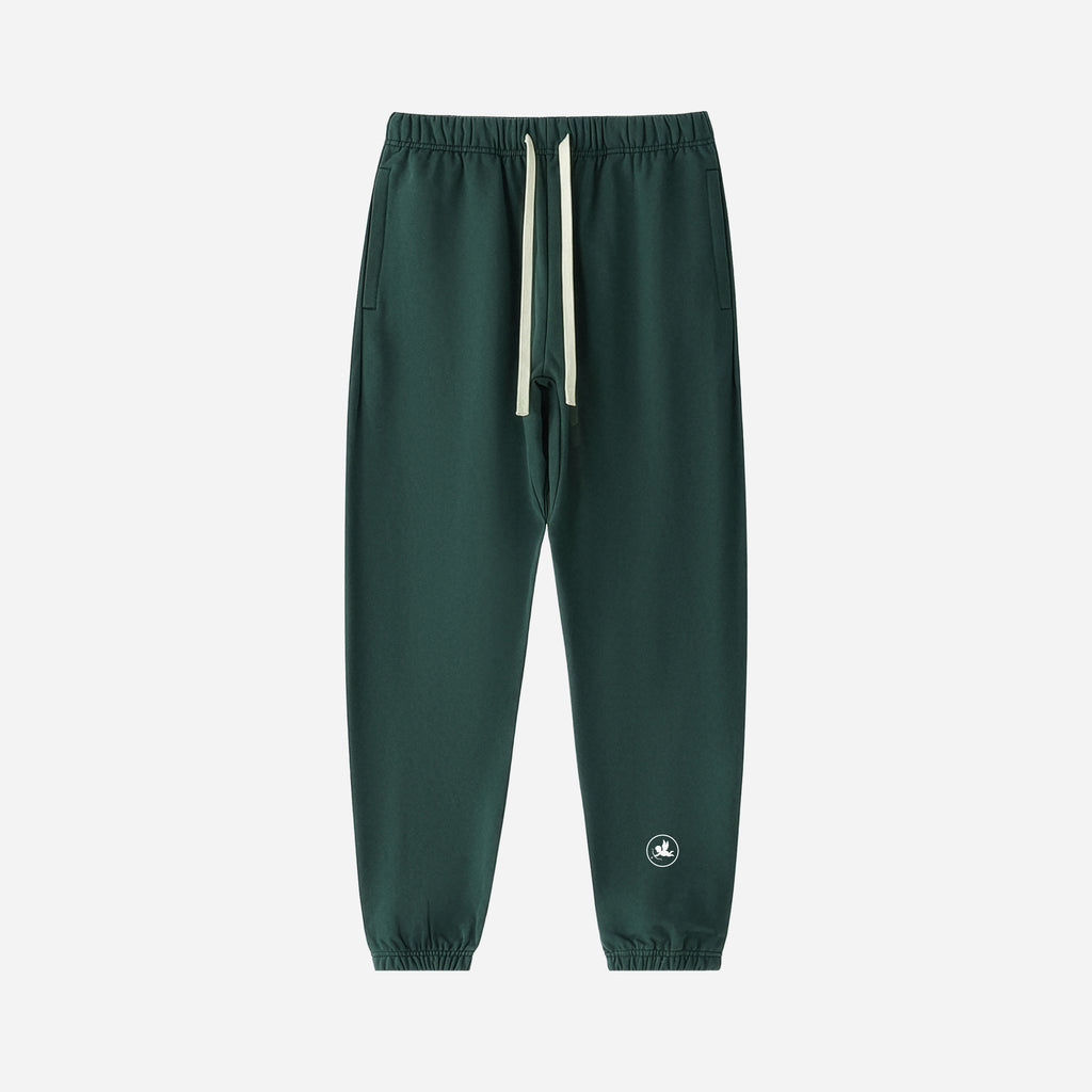 Green jogger pants with a small logo on a light gray background