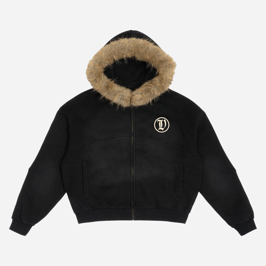 Black jacket by VENT D'HIVER with fur-lined hood on a white background