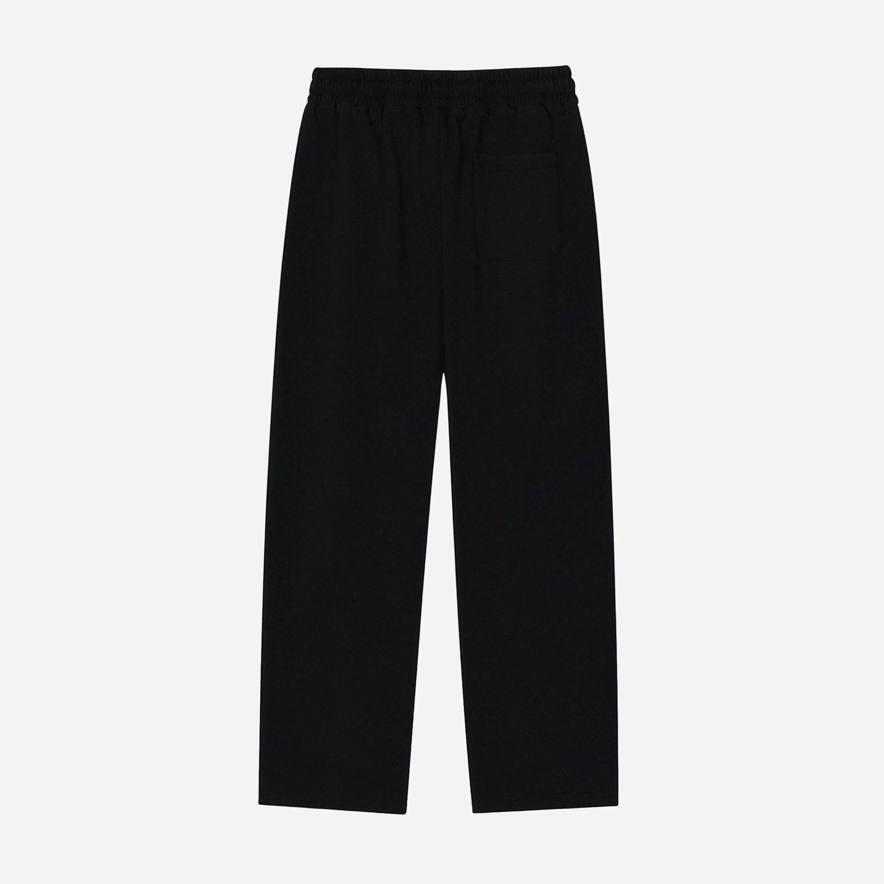 Black pants by VENT D'HIVER on a light gray background