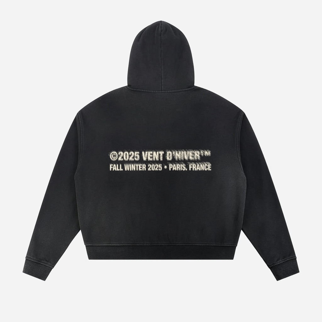 Black hoodie by VENT D'HIVER with text on the back against a white background