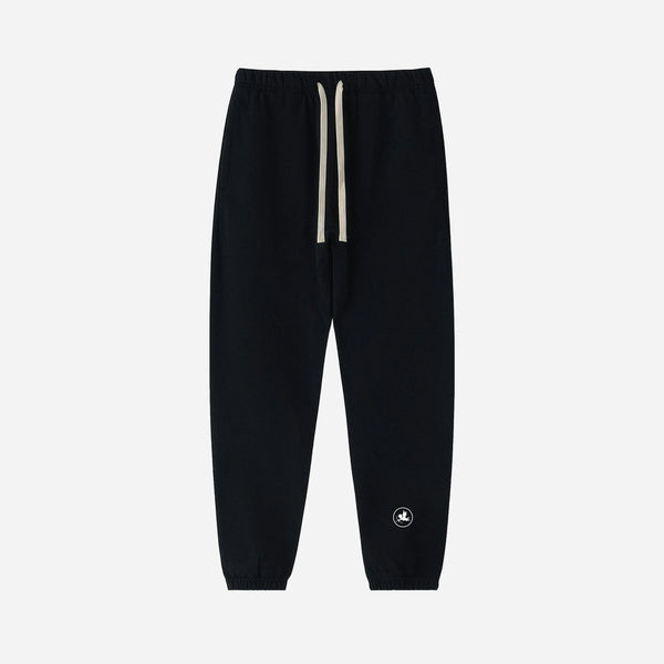 Black sweatpants pants by VENT D'HIVER with a small angel on a white background