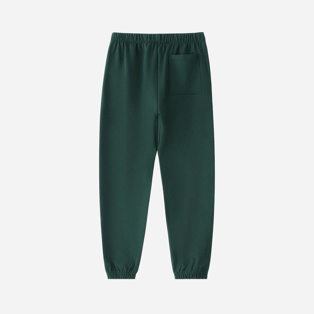 Green sweatpants pants by VENT D'HIVER on a white background