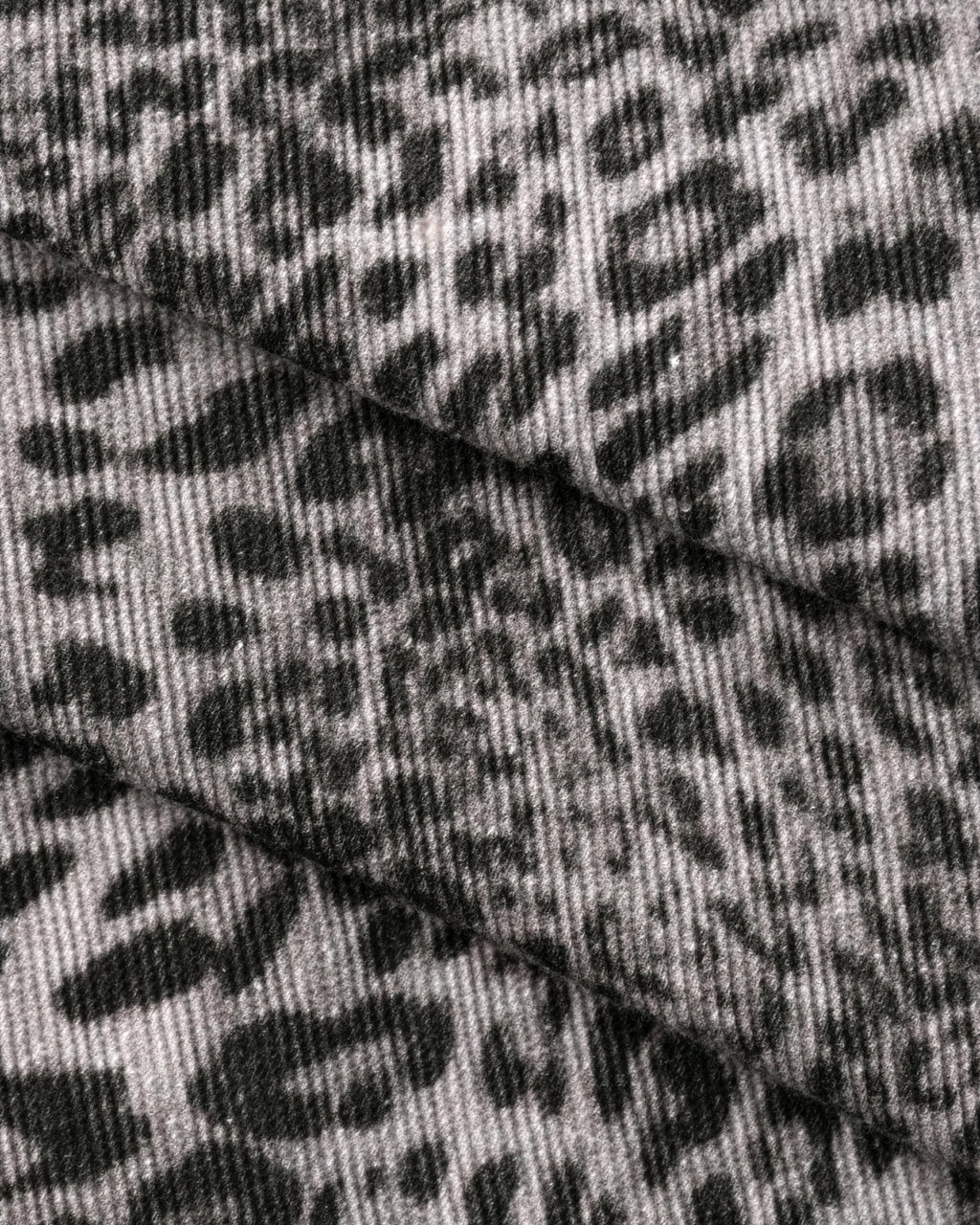 VENT D'HIVER™ Leopard Denim featuring an all-over gray leopard print and signature script logo printed on the back pocket.